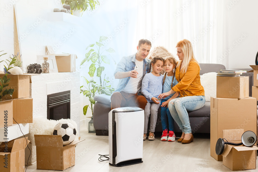 family with an air purifier moving to a new apartment family with an air purifier moving to a new apartment