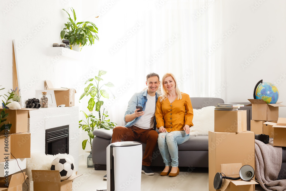 family with an air purifier moving to a new apartment family with an air purifier moving to a new apartment
