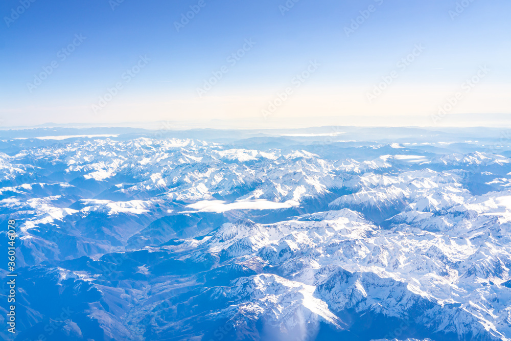 Flight over the snow capped mountains of the Pyrenees