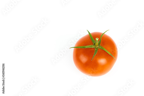 One red tomato isolated on white, copy space and view from above