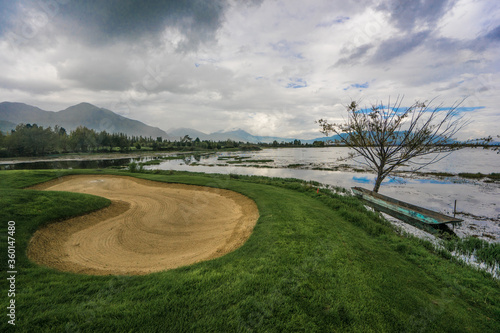 Fototapeta Naklejka Na Ścianę i Meble -  Lijiang Ancient town golf course 