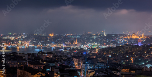 Galata Tower and Suleymaniye Mosque at night in Istanbul, Turkey. © resul