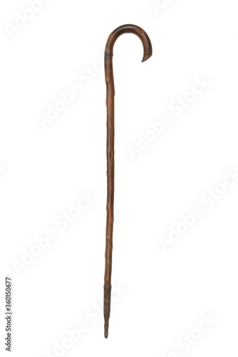 Фотография old original wooden and steel walking stick on white background