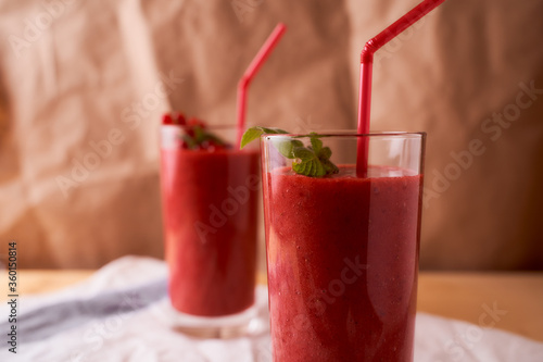 Strawberry and banana smoothies with long glass glasses on tablecloths