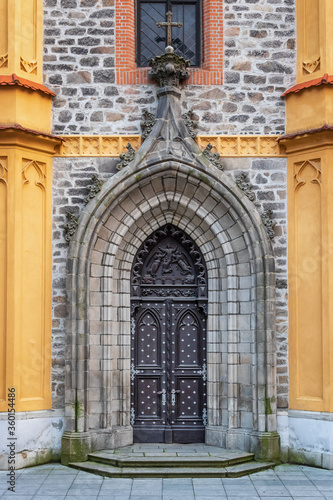 Old massive church door of the catholic church