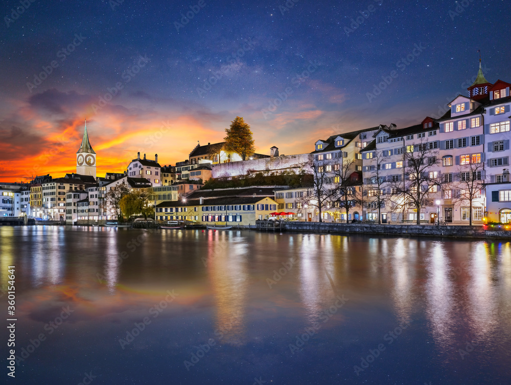 Long exposure of limmat river side swiss city at night in Zurich Switzerland