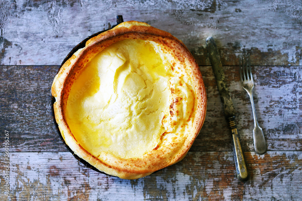 Dutch baby pancake in a pan. Fresh homemade Dutch baby cake. Dutch baby pancake in a pan. Fresh homemade Dutch baby cake.
