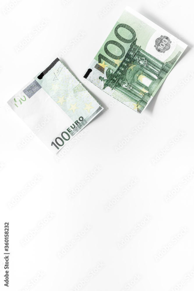Cutting of euro banknote. Economic crisis concept Cutting of euro banknote. Economic crisis concept