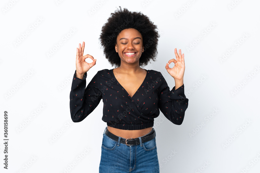 Young African American woman isolated on white background in zen pose Young African American woman isolated on white background in zen pose