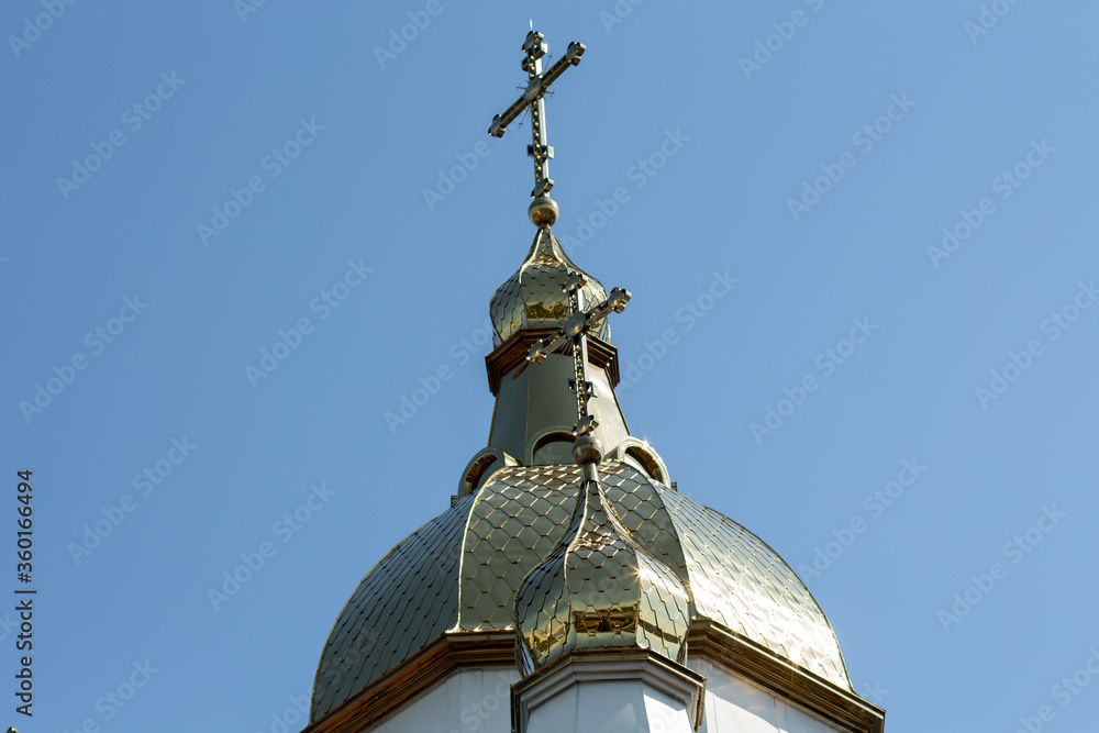 golden domes of the church against the blue sky