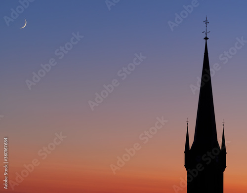 St. Petri Church Silhouette in Dresden germany with the 2.5 days old new moon