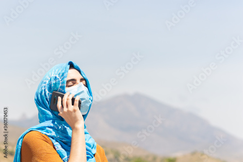 Portrait of a woman with a face mask photo