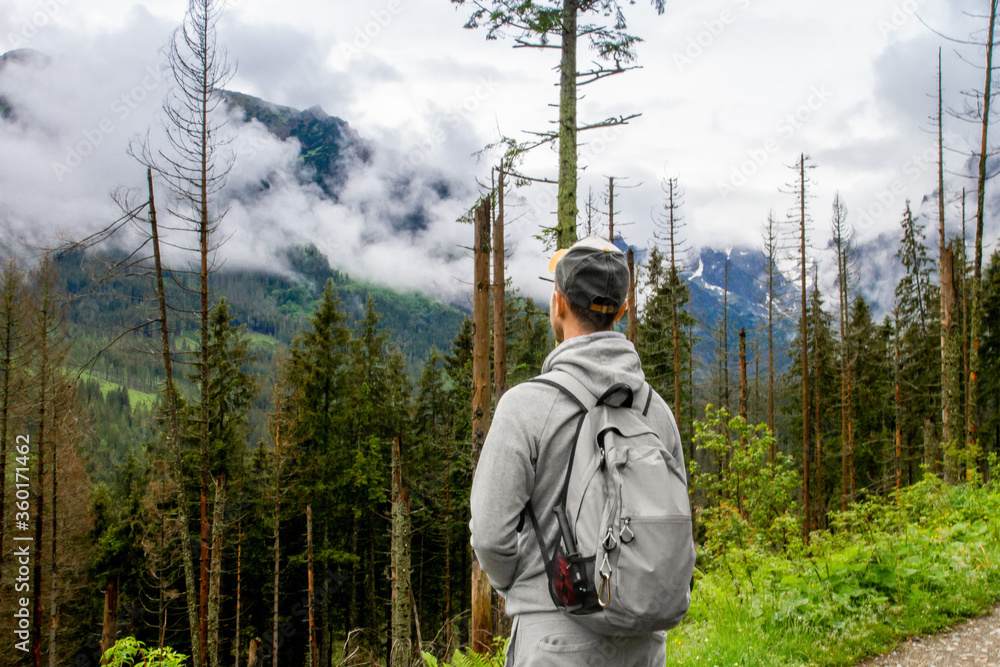 A man travels to the mountains. Hiking. High mountains in summer on a rainy day. Тatras. A man travels to the mountains. Hiking. High mountains in summer on a rainy day. Тatras.