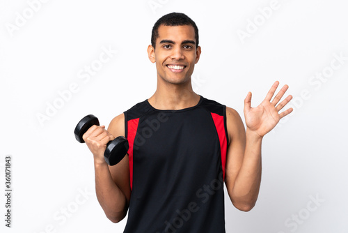 African American sport man over isolated white background saluting with hand with happy expression