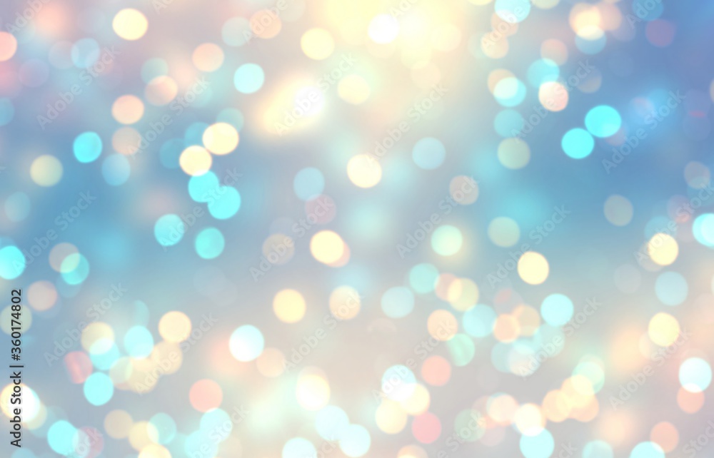 Bokeh yellow blue festive glow background. Holiday glitter texture. Abstract pattern.