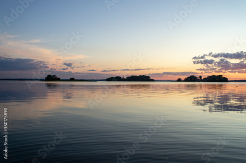 Magical fairytale sunset in the evening on the lake