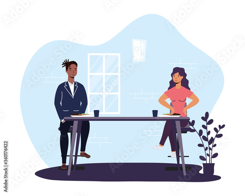 interracial couple dinning in restaurant practicing social distancing ,covid19 prevention method