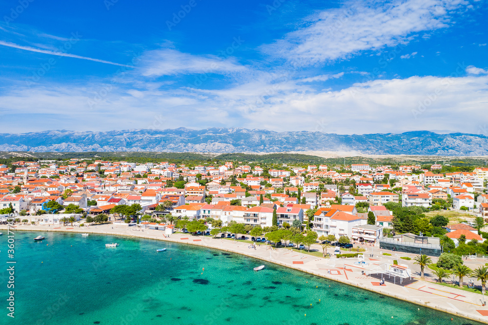 Croatia, beautiful Adriatic coastline, town of Novalja and marina on the island of Pag, aerial view from drone