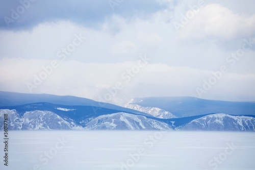 Winter landscape. Baikal lake. Snowy mountains