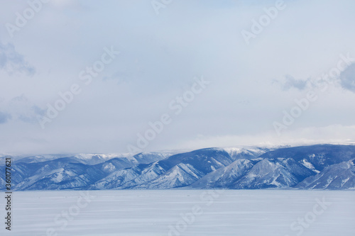 Winter landscape. Baikal lake. Snowy mountains