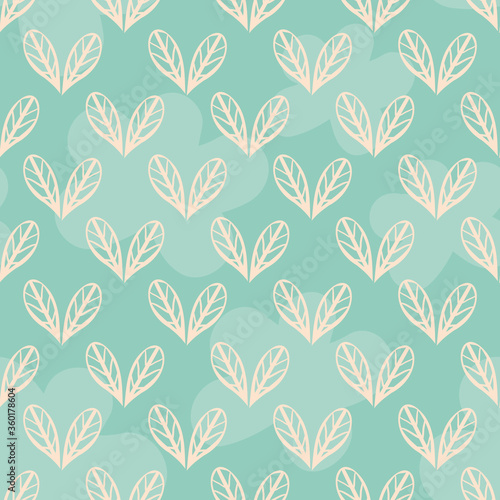 Vector wild meadow leaves seamless pattern background. Yellow foliage arranged into heart shapes on mint blue backdrop. Textural geometric design. Simple hand drawn repeat for wellness and spa concept