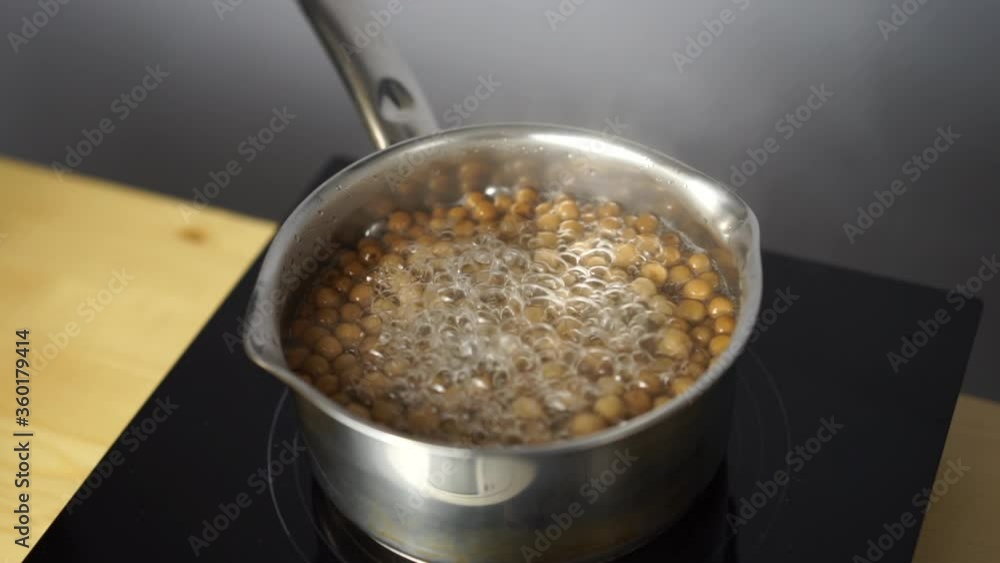 natural tapioca for bubble tea is boiled in a pan. tapioca cooking