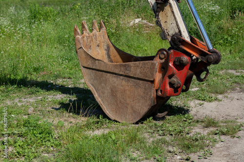 old tractor bucket on the grass
