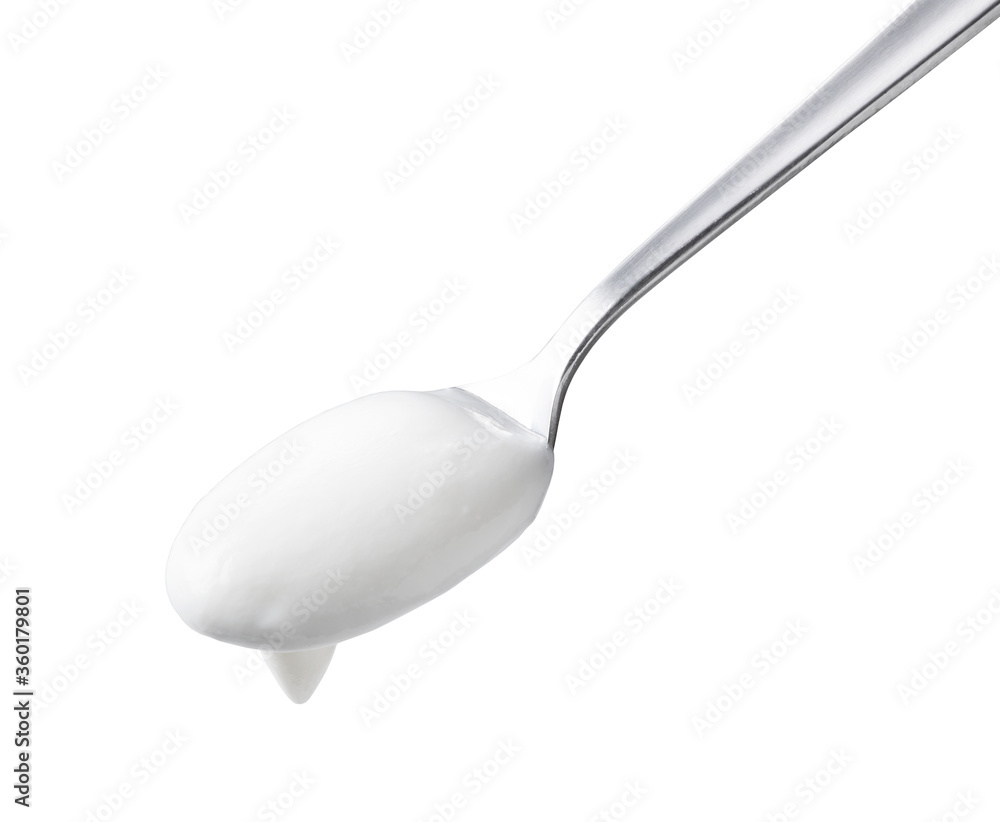 Spoon and yogurt on a white background Spoon and yogurt on a white background