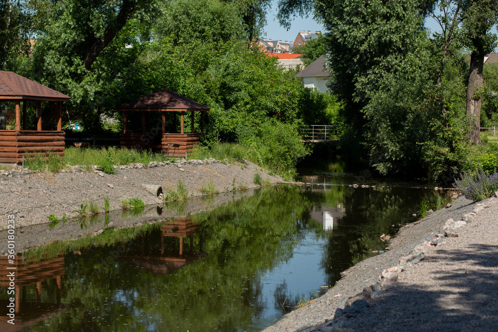 decorative river in the city with wooden houses decorative river in the city with wooden houses