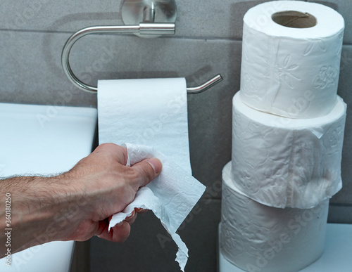Hand Using Toilet Paper. diarrhea constipation .Health concept