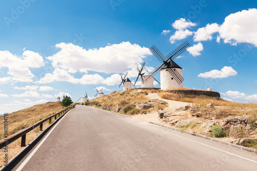 Traditional windmills in La Mancha, Spain. Blue sky background.