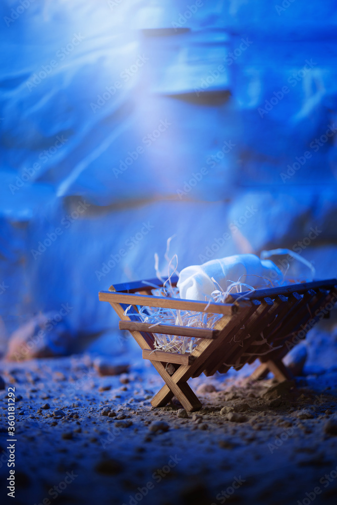 Wooden manger and star of Bethlehem in cave, nativity scene background ...