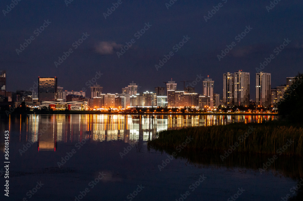 City lights at night with reflection in water