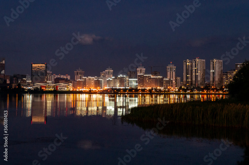 City lights at night with reflection in water