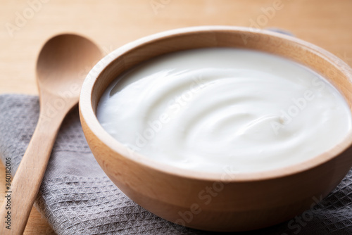 Yogurt on a wooden background