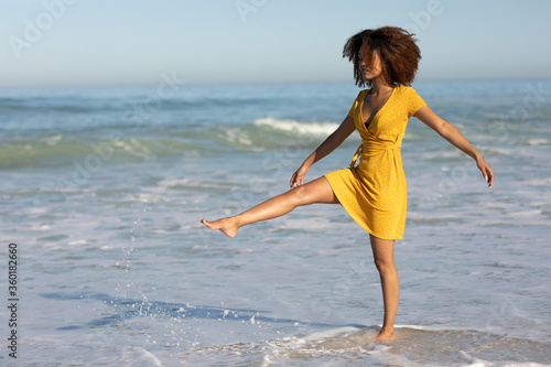 Mixed race woman standing on the beach
