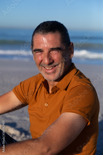Senior Caucasian man enjoying time on the beach