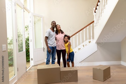 Couple and their daughter arriving in their new home