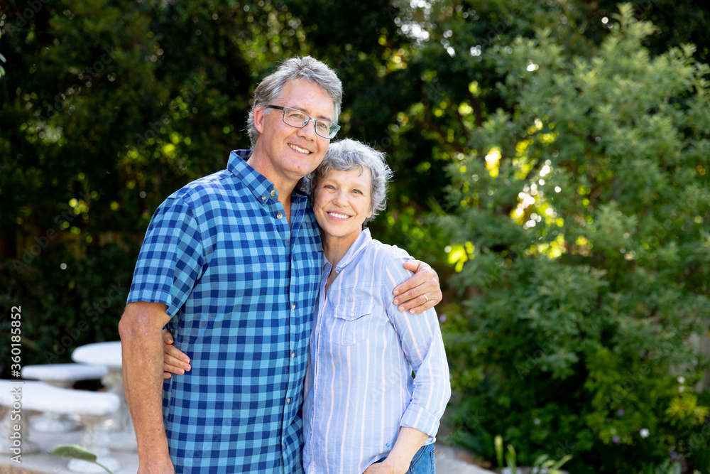 Senior Caucasian couple spending time together in their garden