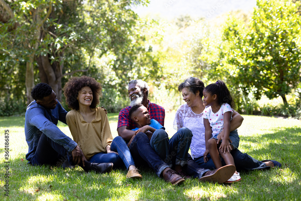 Multi-generation mixed race family enjoying their time at a garden Multi-generation mixed race family enjoying their time at a garden