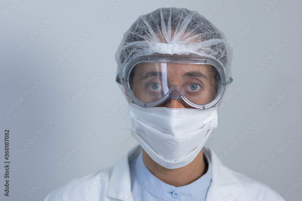 Healthcare worker wearing protective suit and face mask during coronavirus Covid19 pandemic