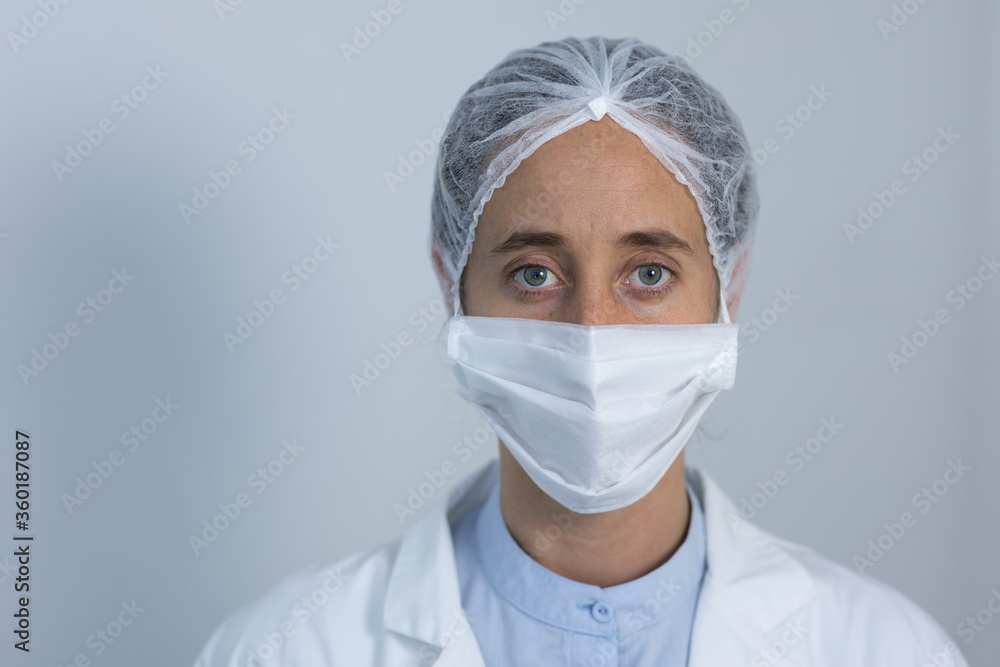Healthcare worker wearing protective suit and face mask during coronavirus Covid19 pandemic Healthcare worker wearing protective suit and face mask during coronavirus Covid19 pandemic