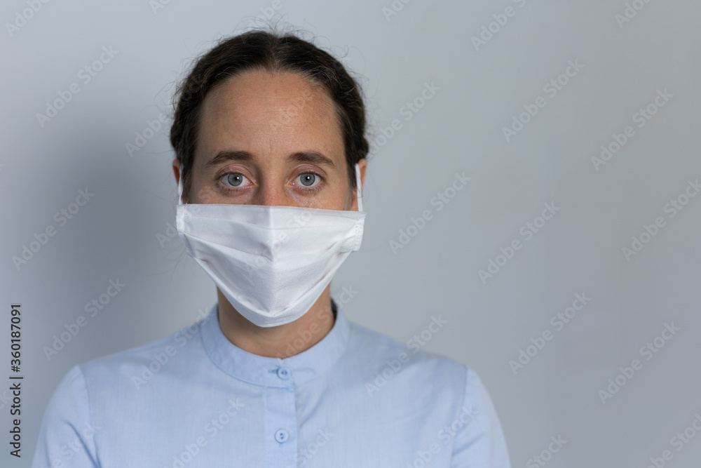 Healthcare worker wearing protective suit and face mask during coronavirus Covid19 pandemic Healthcare worker wearing protective suit and face mask during coronavirus Covid19 pandemic