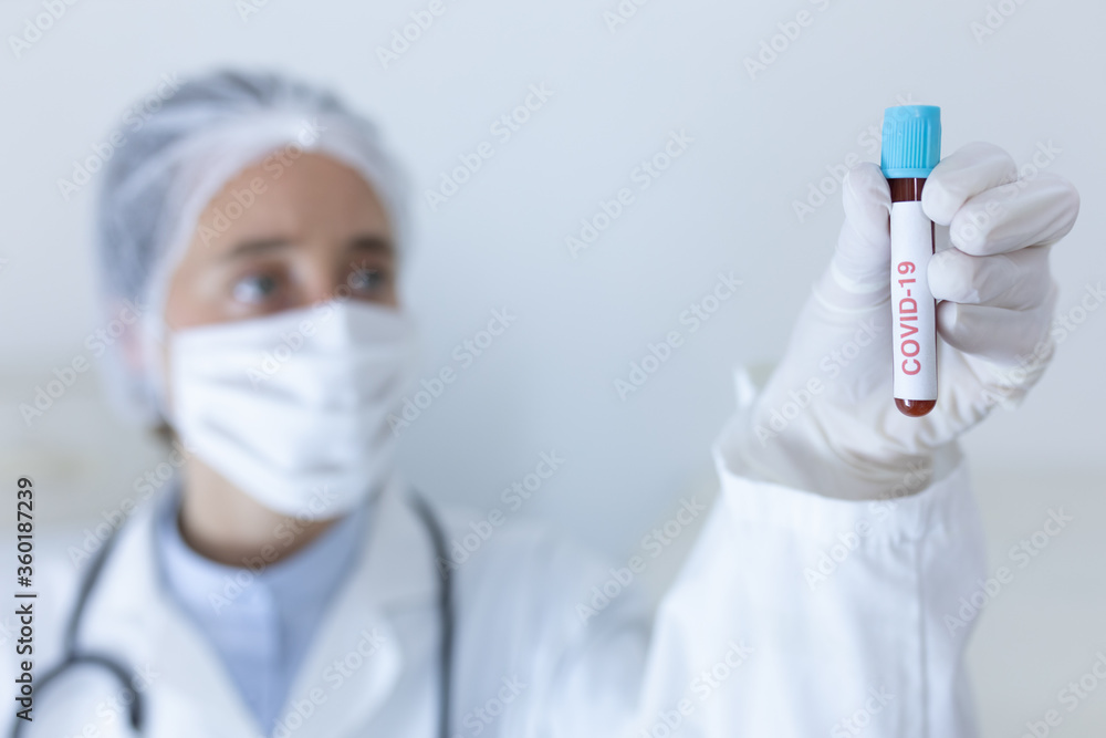 Healthcare worker wearing protective suit and face mask during coronavirus Covid19 pandemic Healthcare worker wearing protective suit and face mask during coronavirus Covid19 pandemic