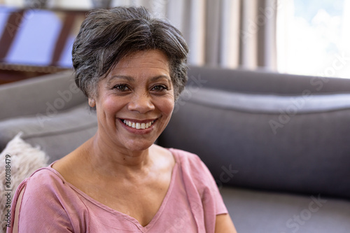 Senior mixed race woman sitting on a couch