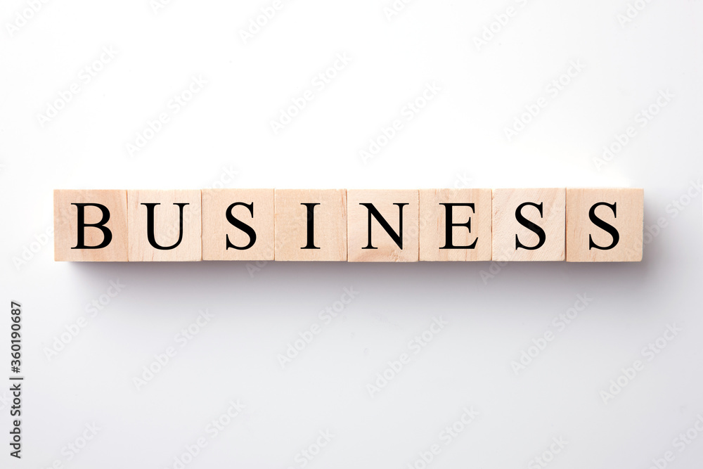 Business text on wood block on White background. Business text on wood block on White background.