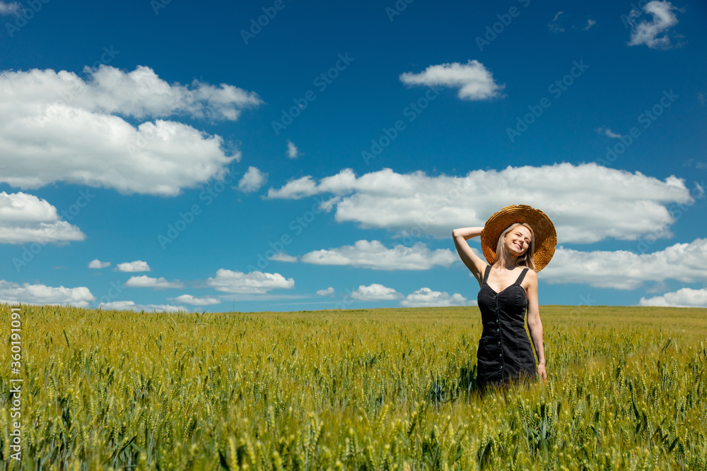 Beautiful blonde girl in wheat field in sunny day Beautiful blonde girl in wheat field in sunny day