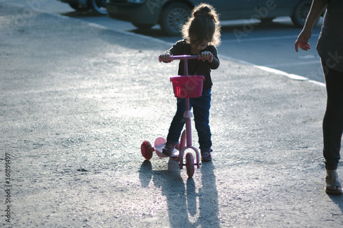 Yong kid girl ride on stree...