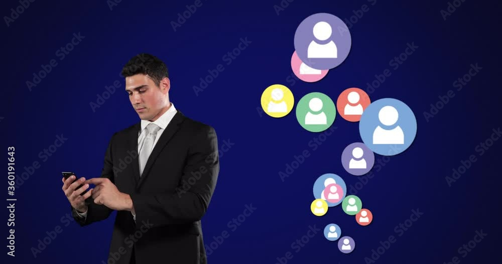 Young Caucasian man using phone with profile icons spawning Young Caucasian man using phone with profile icons spawning