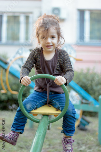Child kid girl swinging on ...